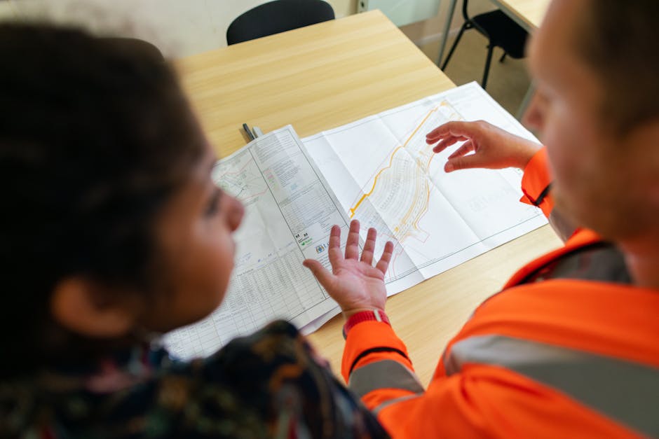 Engineer with master plan drawings on table